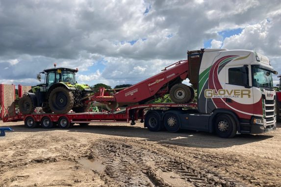Glover lorry transporting tractor to the site